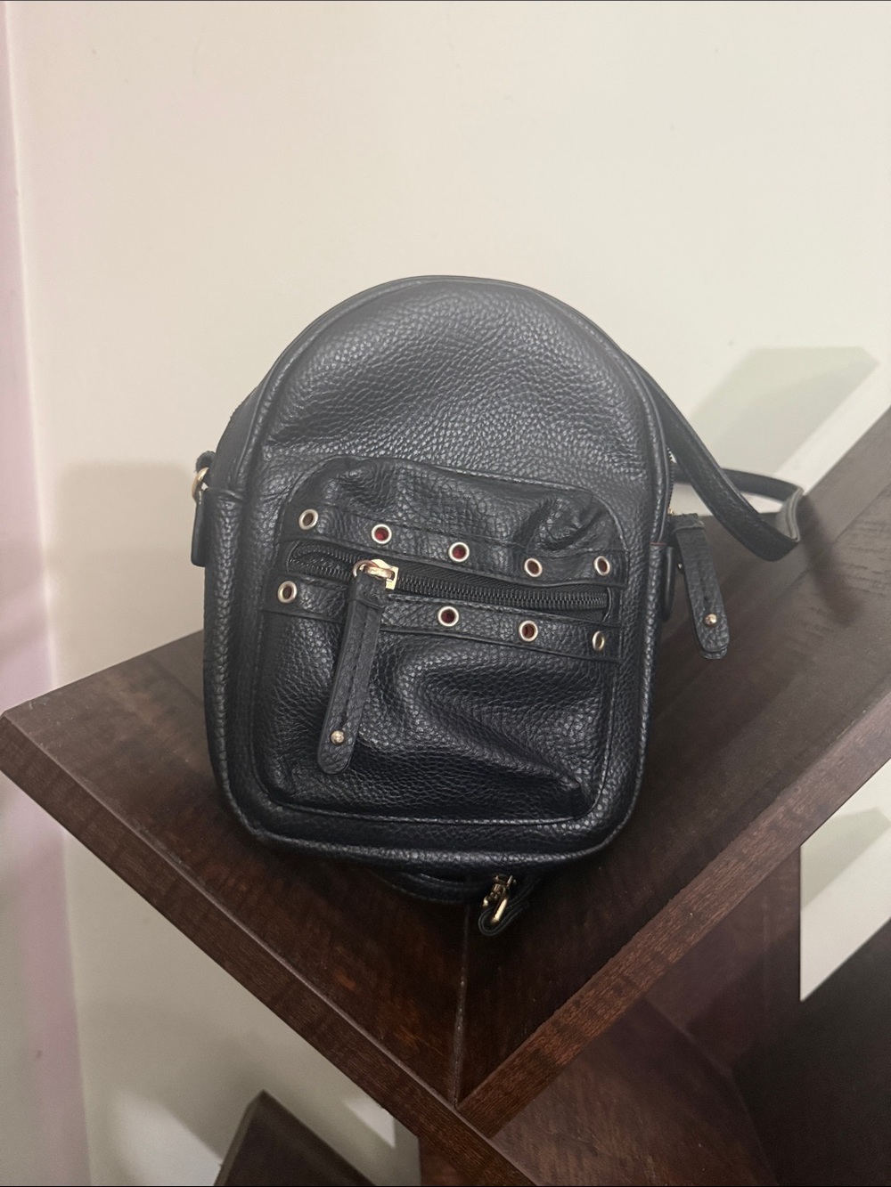 Black Pebbled Leather Crossbody Bag with Grommet Detail
